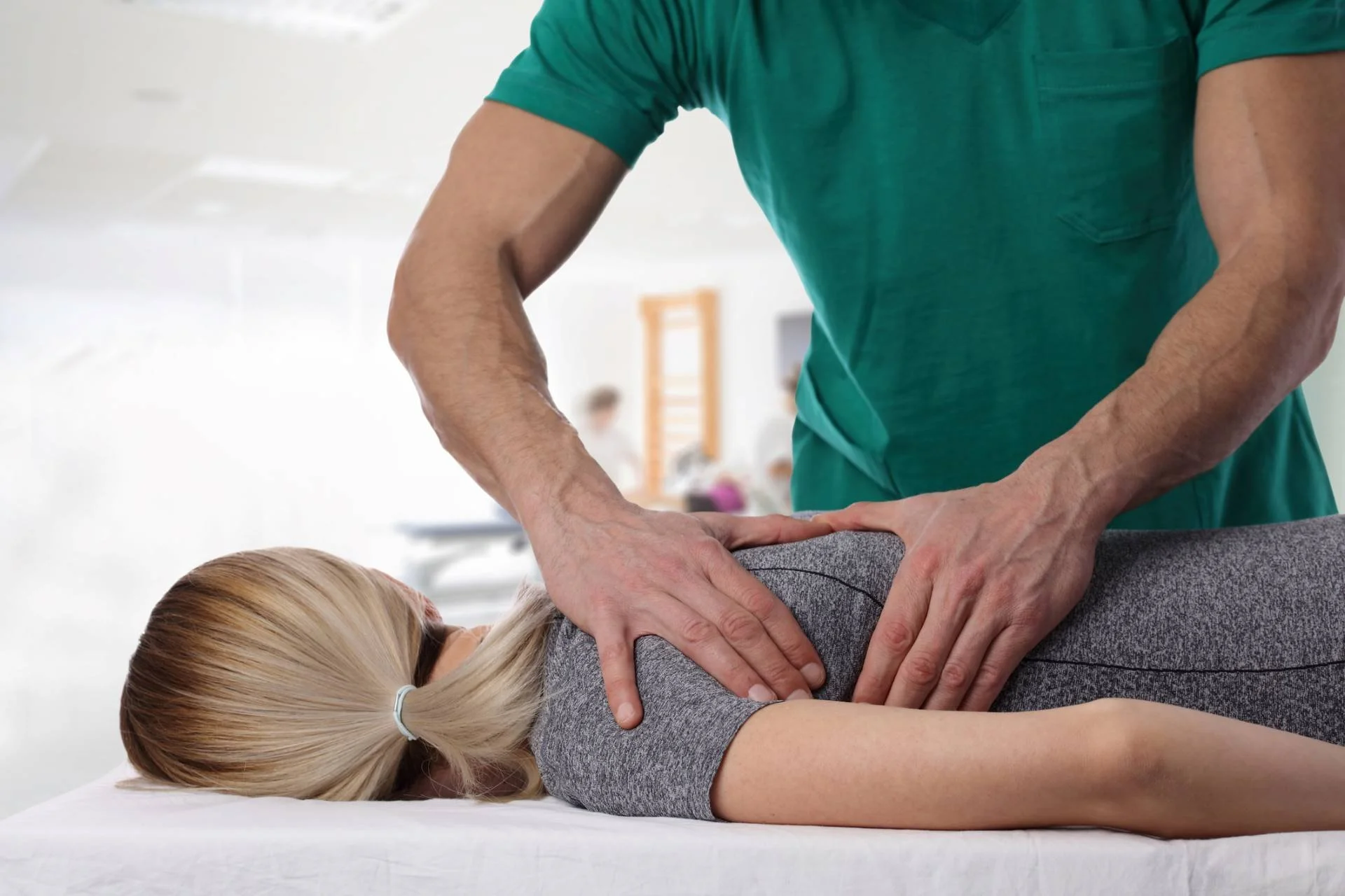Chiropractic Massage Explained - Womanhavingchiropracticbackadjustment 1
