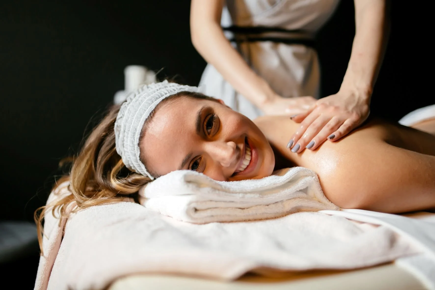 Benefits of Regular Massages - beautiful woman enjoying massage
