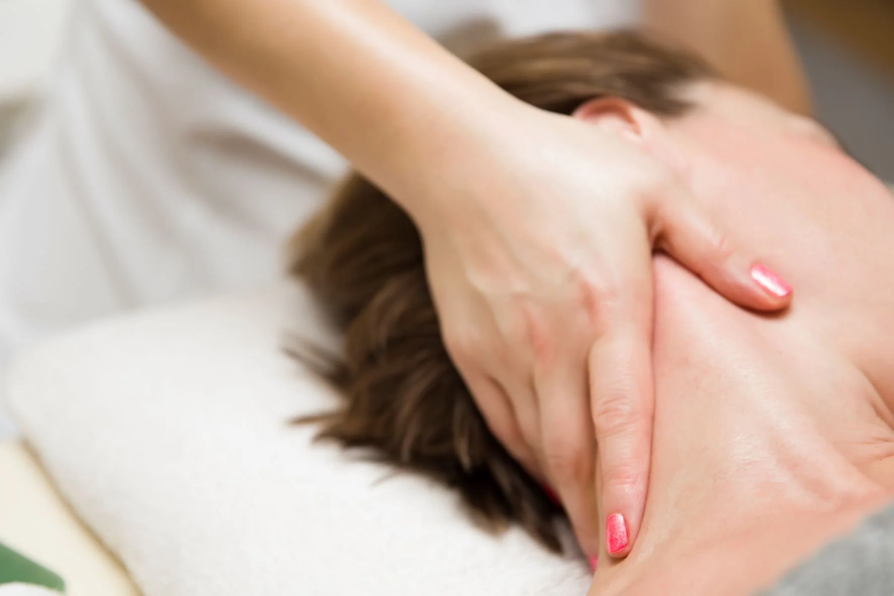 Best Massage for Neck and Shoulder Pain - woman getting a stress relieving pressure point 1