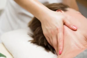 Best Massage for Neck and Shoulder Pain - woman getting a stress relieving pressure point